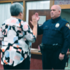 TRENTON CITY CLERK Karen Buzzard swear- ing in newly hired police officer Steve Howe